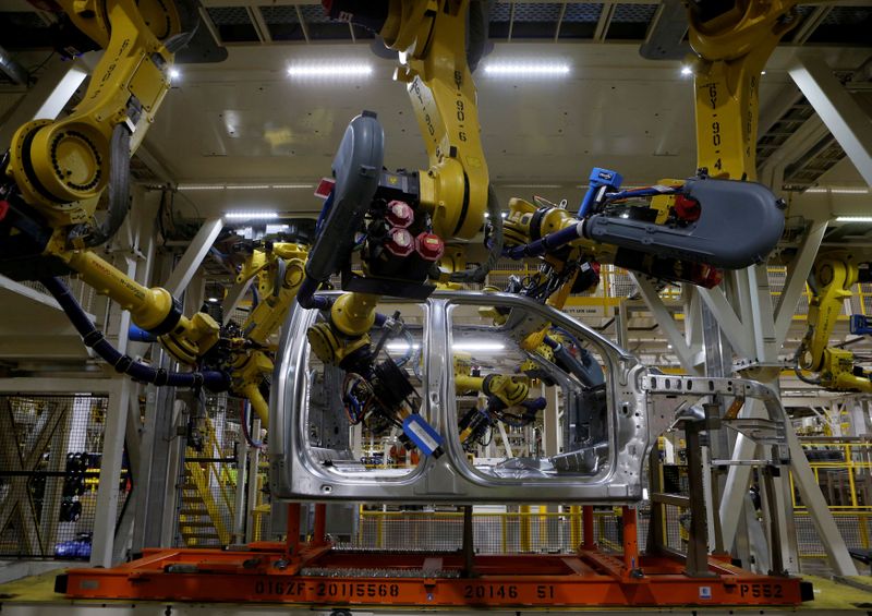 © Reuters. FILE PHOTO: File photo of the aluminium cab of the then all-new 2015 F-150 pick-up truck moves down the robot assembly line at the Ford Rouge Center in Dearborn, Michigan