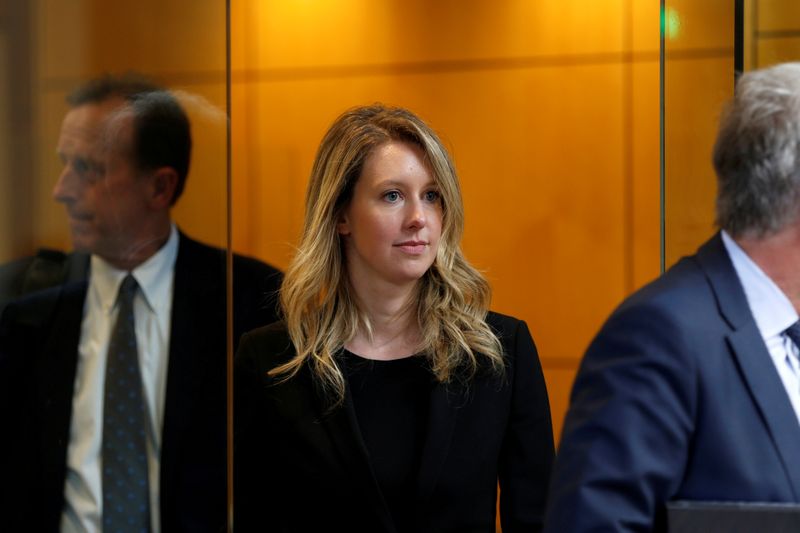 U.S. judge drops some charges against Theranos's Holmes, leaves wire fraud