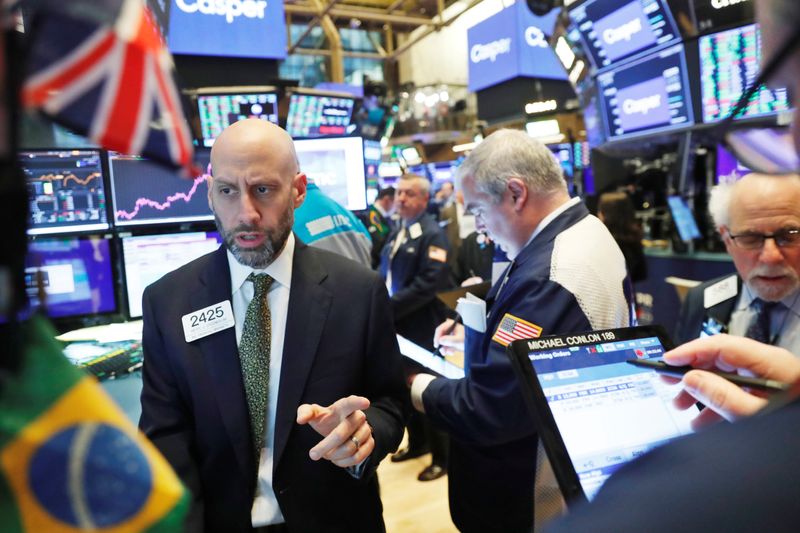 © Reuters. Traders work on the floor of the New York Stock Exchange shortly after the opening bell in New York