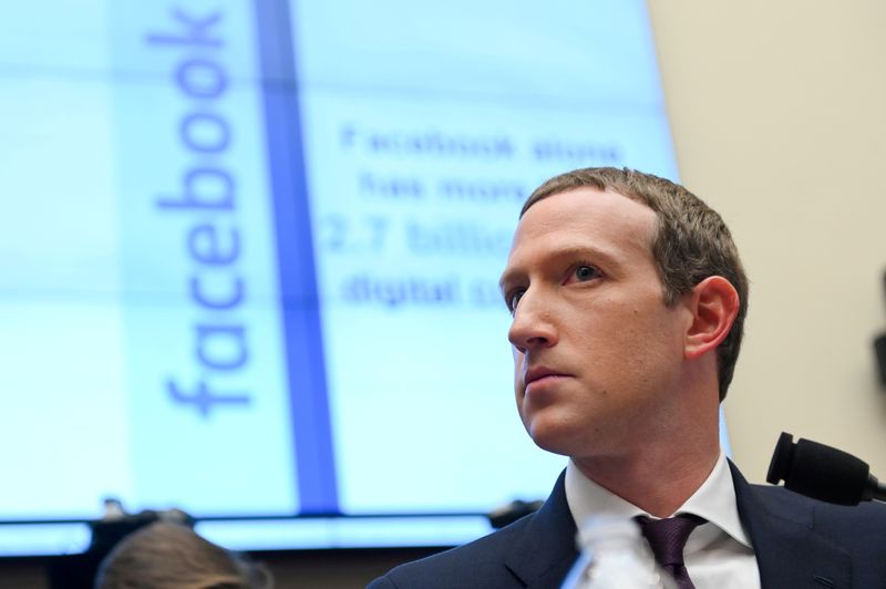 © Reuters. FILE PHOTO: Facebook Chairman and CEO Zuckerberg testifies at a House Financial Services Committee hearing in Washington