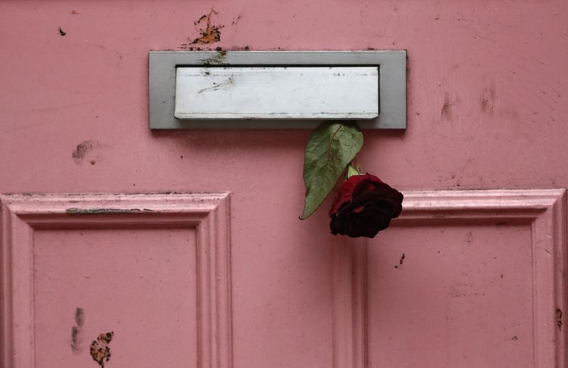 © Reuters. A rose is placed in the letterbox of British television presenter Caroline Flack's old house in Islington, London