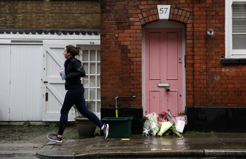 © Reuters. FILE PHOTO: Flowers lie outside British television presenter Caroline Flack's old house in Islington, London