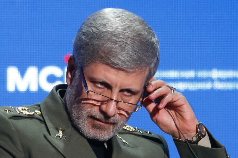 © Reuters. FILE PHOTO: Iranian Defence Minister Amir Hatami adjusts a headphone during the annual Moscow Conference on International Security in Moscow