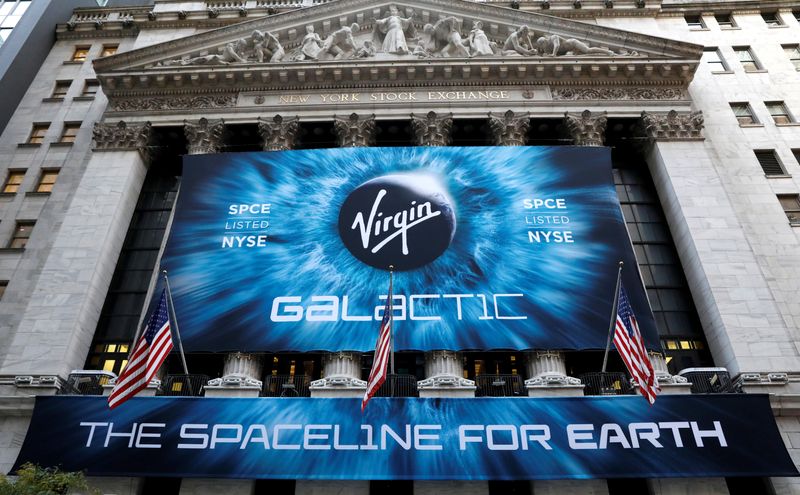 © Reuters. FILE PHOTO: A banner hangs on the outside of the New York Stock Exchange (NYSE) ahead of Virgin Galactic (SPCE) IPO in New York