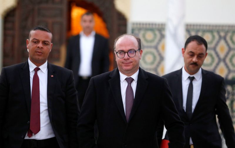 © Reuters. Tunisian Prime Minister Elyes Fakhfakh leaves for a meeting with Tunisian President Kais Saied in Tunis