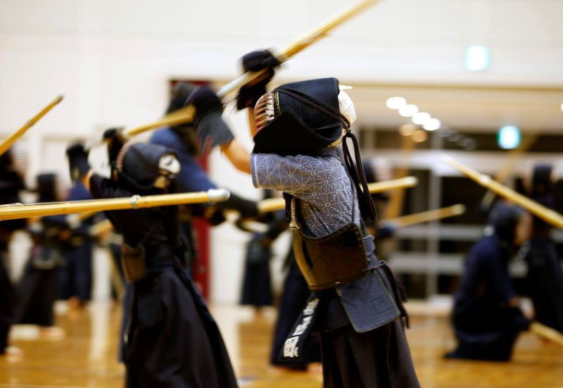 © Reuters. A child practices kendo at the gymnasium of a primary school in Fukuoka