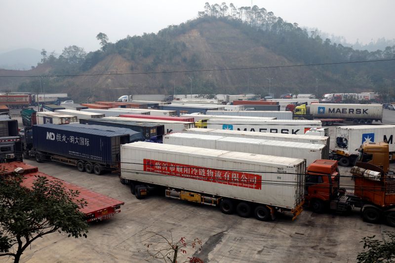 © Reuters. Container trucks are seen while waiting for cross the border at Huu Nghi border gate connecting with China, in Lang Son province, Vietnam