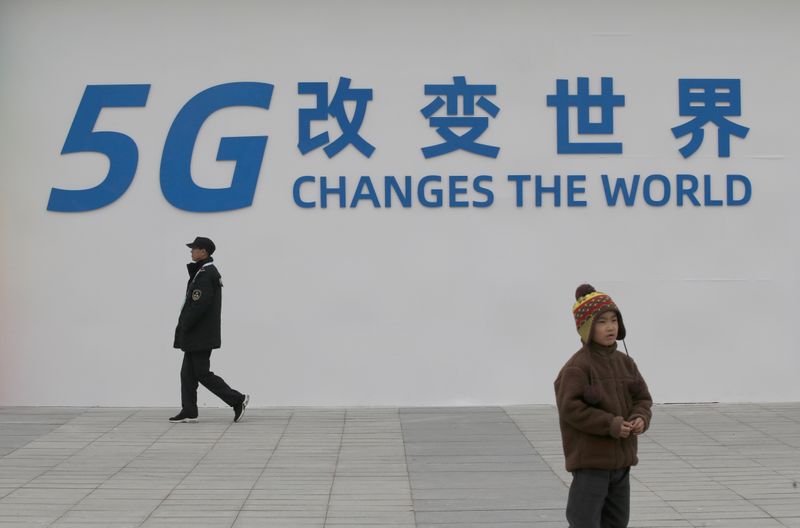 © Reuters. FILE PHOTO: A sign for the World 5G Exhibition is seen in Beijing