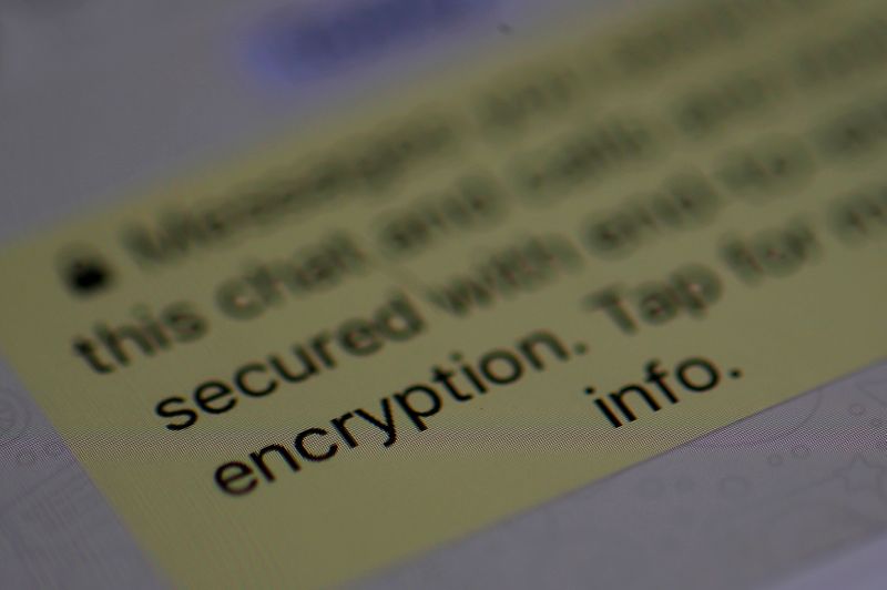 © Reuters. FILE PHOTO: An encryption message is seen on the  WhatsApp application on an iPhone i