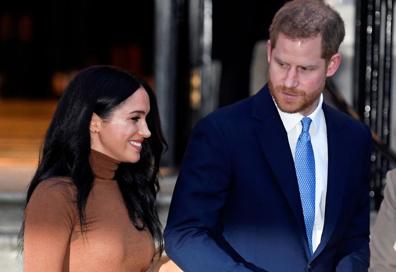 © Reuters. FILE PHOTO: Britain's Prince Harry and his wife Meghan, Duchess of Sussex, leave Canada House in London