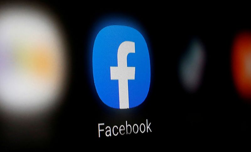 © Reuters. A Facebook logo is displayed on a smartphone in this illustration