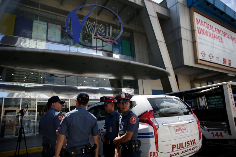 Sacked security guard holds dozens hostage at Philippine mall By Reuters