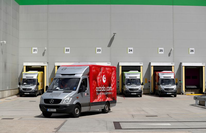 © Reuters. FILE PHOTO: A delivery van leaves the dispatch area of the Ocado customer fulfilment centre in Andover
