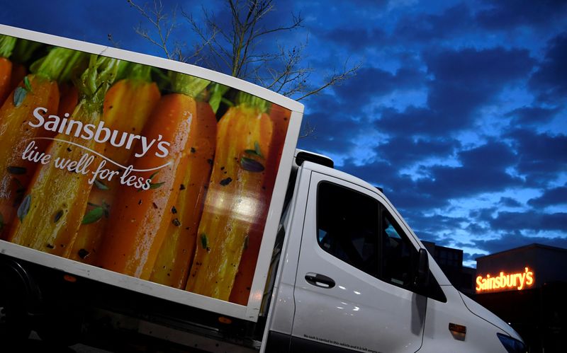 © Reuters. FILE PHOTO: Signage for Sainsbury's is seen on delivery vans at a branch of the supermarket in London