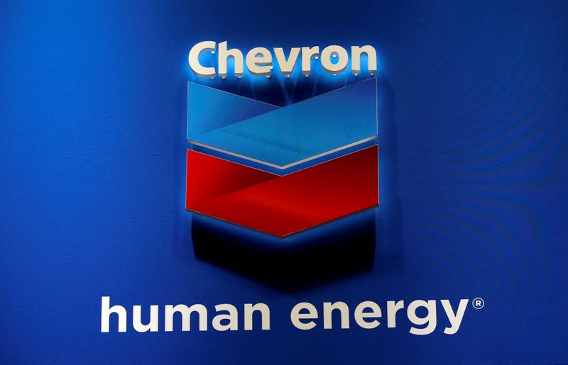 © Reuters. FILE PHOTO: The logo of Chevron Corp is seen in its booth at Gastech, the world's biggest expo for the gas industry, in Chiba
