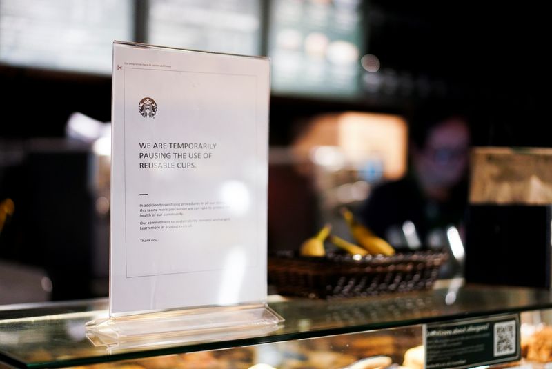 © Reuters. A sign explaining that drinks will not be served in reusable cups is seen inside a Starbucks in London