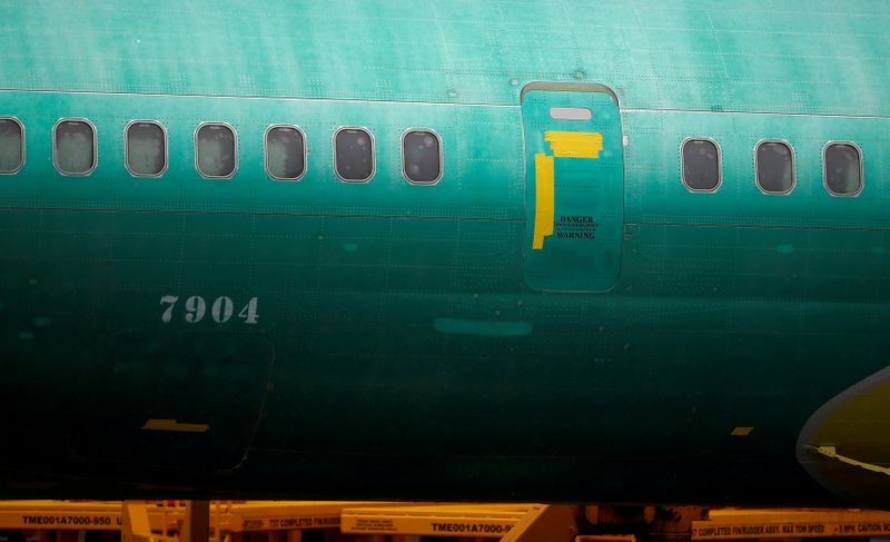 © Reuters. FILE PHOTO: The side of a Boeing 737 Max fuselage is seen parked outside the company's production facility in Renton