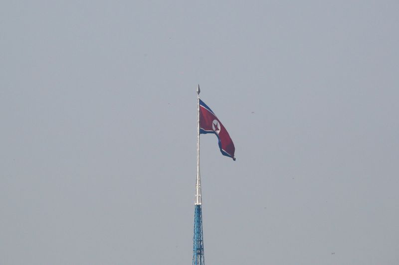 © Reuters. FILE PHOTO - A North Korean flag flutters on top of a tower at North Korea's propaganda village of Gijungdong, as seen from Paju