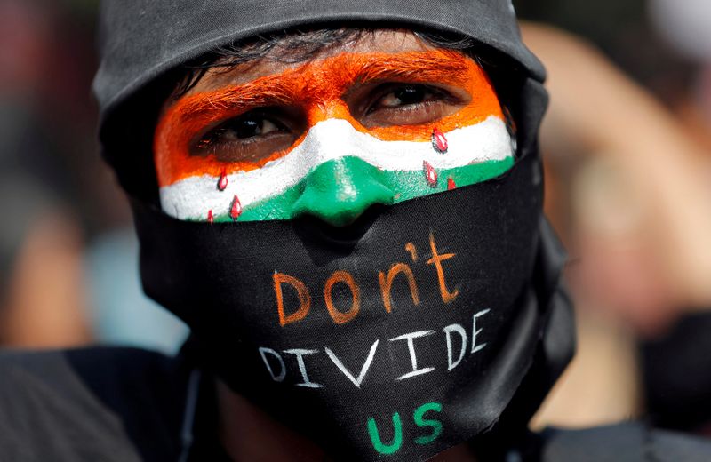 © Reuters. A demonstrator attends a protest against riots following clashes between people demonstrating for and against a new citizenship law in New Delhi