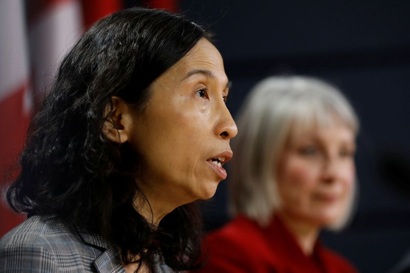 © Reuters. Canada's Chief Public Health Officer Dr. Theresa Tam, with Minister of Health Patty Hajdu, takes part in a news conference in Ottawa