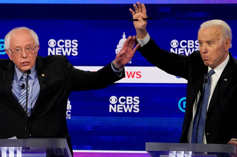 © Reuters. Democratic 2020 U.S. presidential candidates Sanders and Biden participate in the tenth Democratic 2020 presidential debate at the Gaillard Center in Charleston, South Carolina