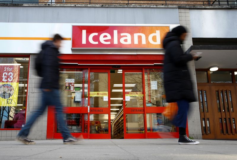 © Reuters. People walk past an Iceland store in London