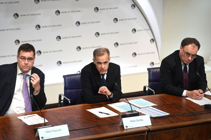 © Reuters. Mike Peacock, Executive Director of Communications at Bank of England, Mark Carney, Governor of BOE and Andrew Bailey, Governor-designate of BOE, speak during a news conference at Bank Of England in London