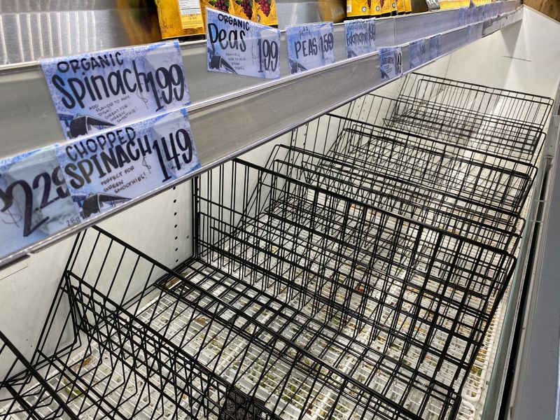 © Reuters. A Trader Joe's grocery store has an empty frozen produce section in Los Angeles, California, U.S., amid reports of the coronavirus