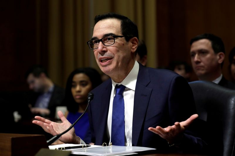 © Reuters. FILE PHOTO: Treasury Secretary Steven Mnuchin testifies before Senate Finance Committee