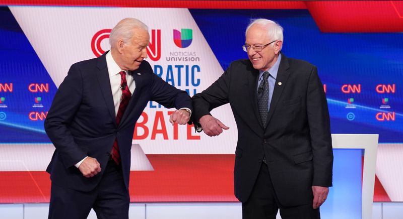 © Reuters. Democratic U.S. presidential candidates Senator Bernie Sanders and former Vice President Joe Biden at the 11th Democratic candidates debate of the 2020 U.S. presidential campaign in Washington