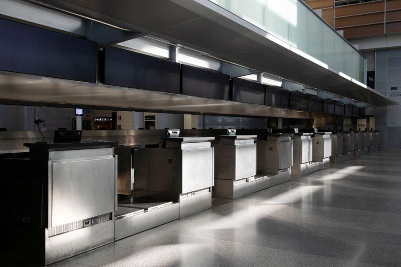 © Reuters. FILE PHOTO: FILE PHOTO: An empty International Terminal of San Francisco International Airport is pictured after the U.S. air travel ban, in San Francisco