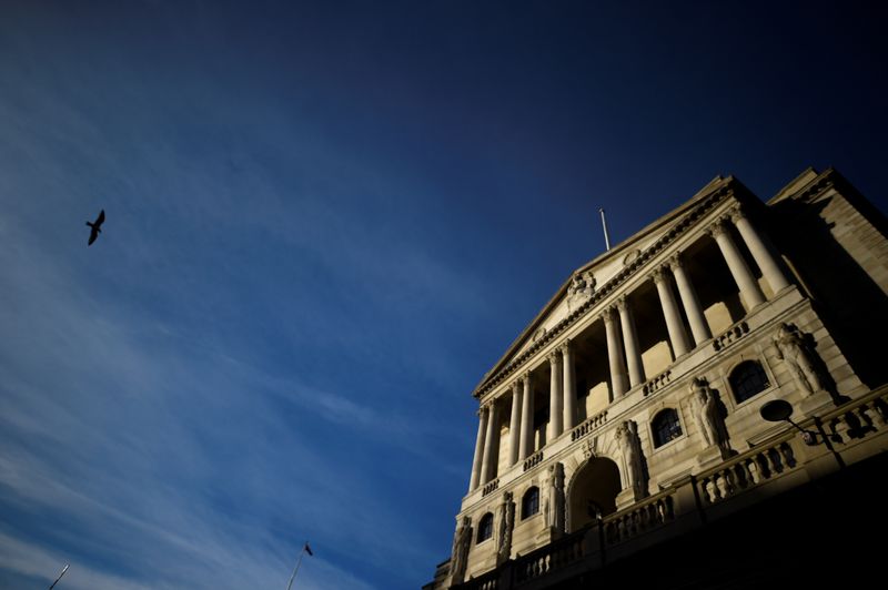 © Reuters. FILE PHOTO: A bird flies past The Bank of England in the City of London