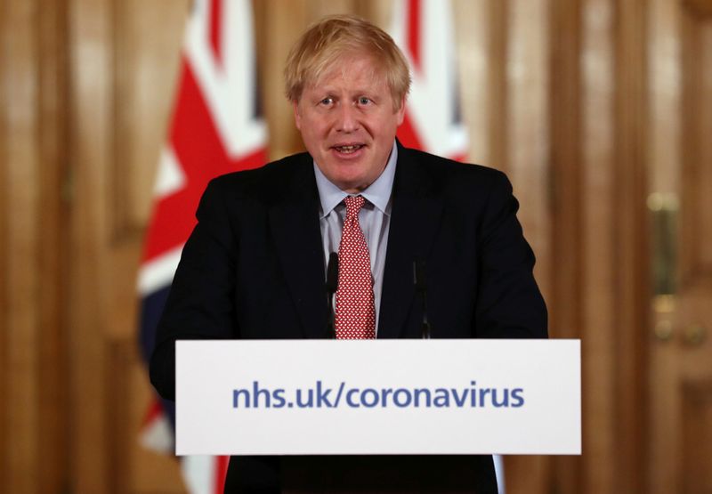 UK's Johnson puts government on war footing to fight coronavirus