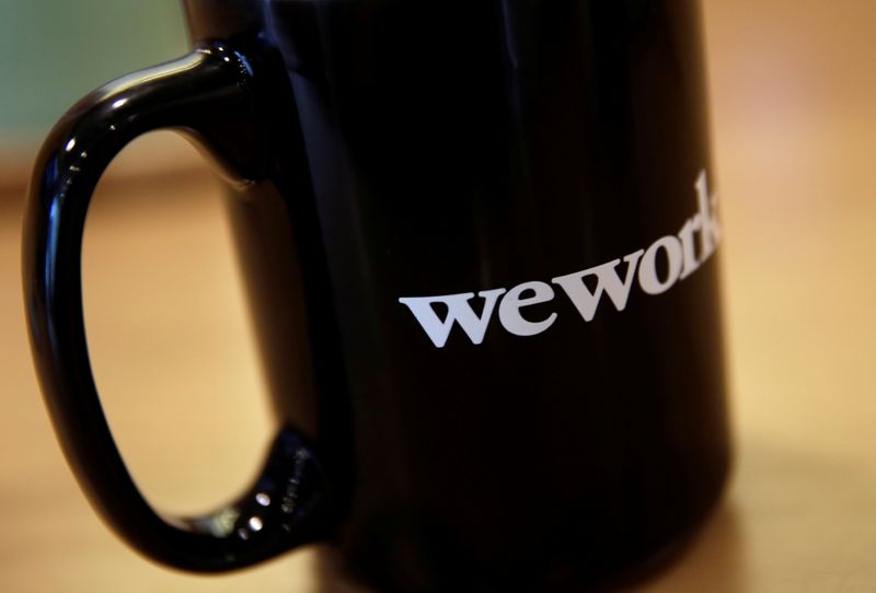 © Reuters. The WeWork logo is seen on a cup at a WeWork office in Beijing