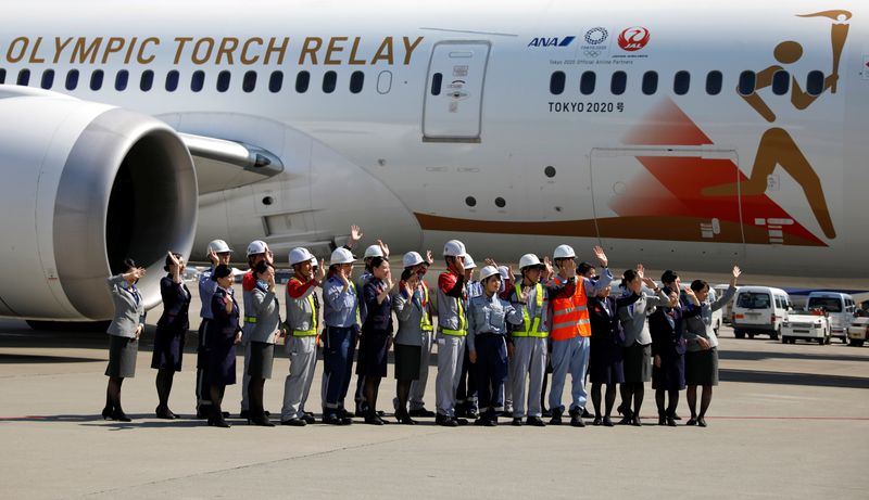 © Reuters. 'Tokyo 2020 Go' aircraft leaves Tokyo's Haneda airport for Greece to collect the Olympic Flame, ahead of torch relay