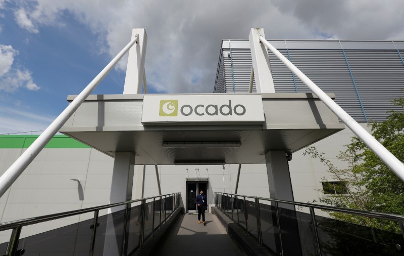 © Reuters. FILE PHOTO: A man walks from the main reception of the Ocado CFC (Customer Fulfilment Centre) in Andover