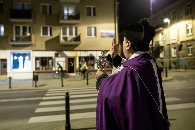 Polish Priest tries to ward off coronavirus with street blessings