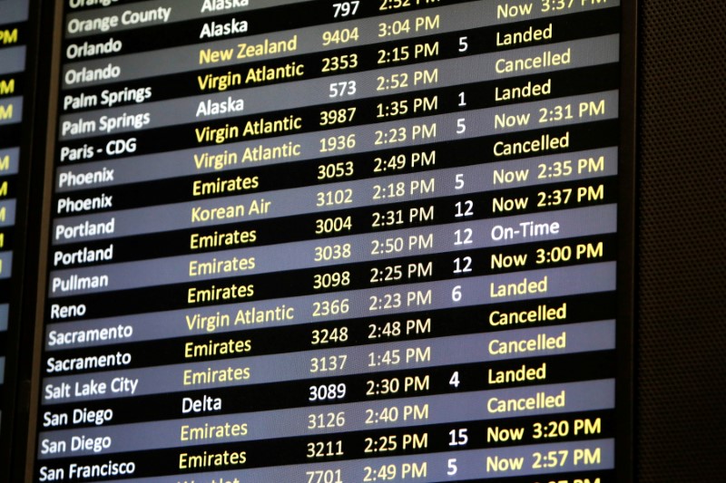 © Reuters. FILE PHOTO: Several canceled flights are pictured on a monitor at Seattle-Tacoma International Airport as airlines are reeling from a plunge in bookings and traffic due to the coronavirus pandemic, in SeaTac, Washington