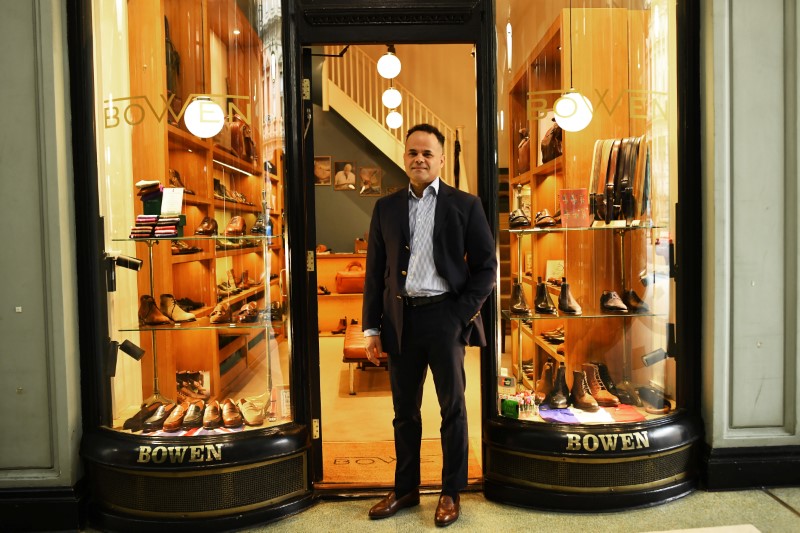 © Reuters. Horles Ramirez, Manager of Bowen, poses outside his store in London