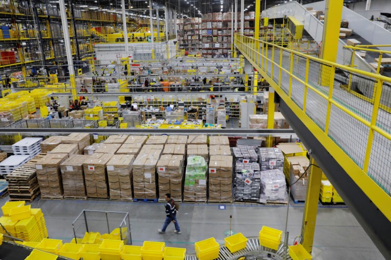 &copy; Reuters. FILE PHOTO: Amazon workers perform their jobs inside of an Amazon fulfillment center on Cyber Monday in Robbinsville, New Jersey