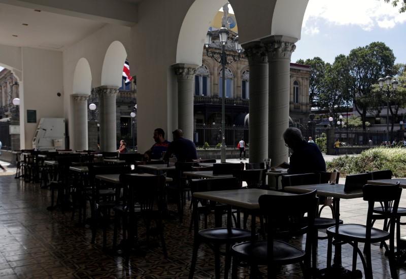 © Reuters. FILE PHOTO: Few people sit in the restaurant of a hotel, as the number of cases of coronavirus disease (COVID-19) grow in the country, in San Jose