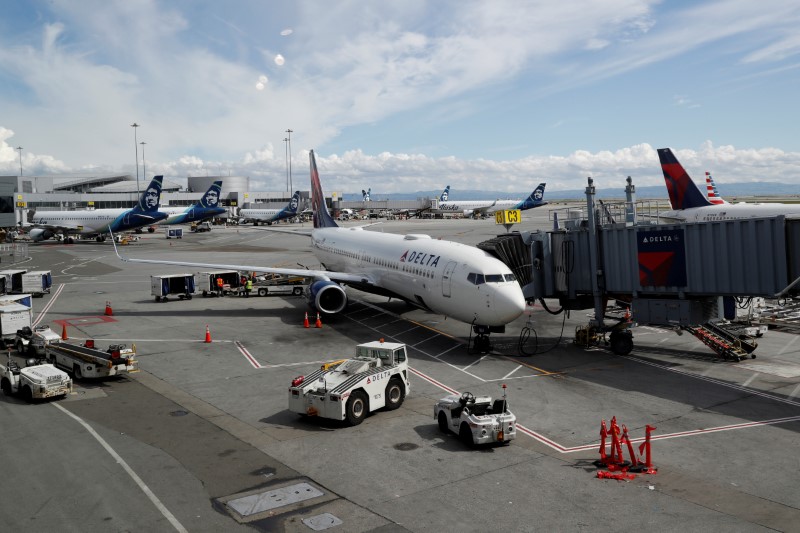 © Reuters. FILE PHOTO: Planes are seen parked at gates at San Francisco International Airport