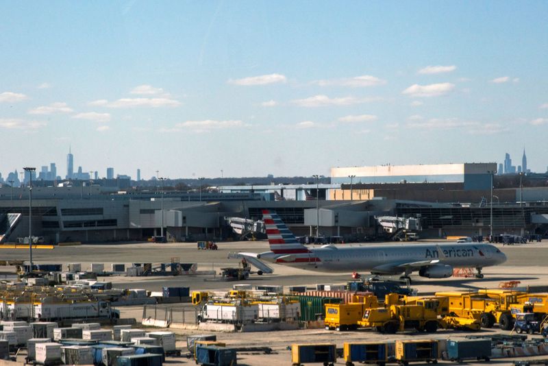 &copy; Reuters. An American airline plane is seen at the tarmac after the Federal Aviation Administration (FAA) temporarily halted flights arriving at New York City airports due to coronavirus disease (COVID-19) in New York