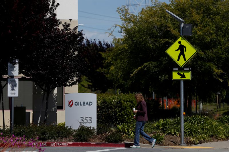 &copy; Reuters. A woman walks past a Gilead Sciences, Inc. office in Foster City, California