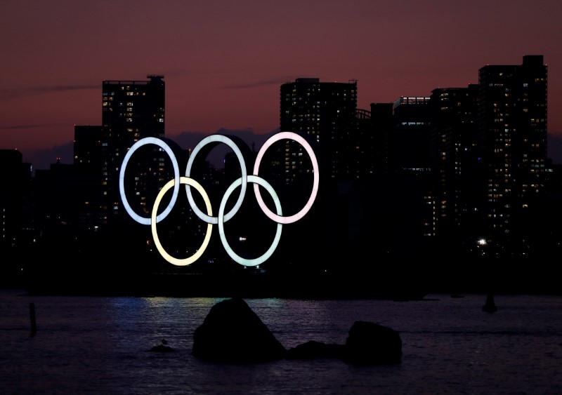 &copy; Reuters. The giant Olympic rings are seen in the dusk at the waterfront area at Odaiba Marine Park in Tokyo