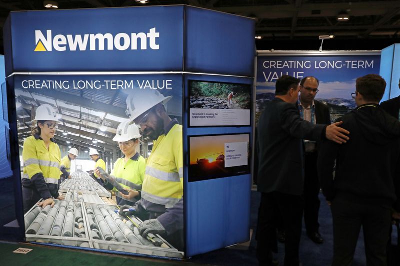 &copy; Reuters. Visitors speak with a representative at the Newmont Corp booth at the PDAC annual conference in Toronto