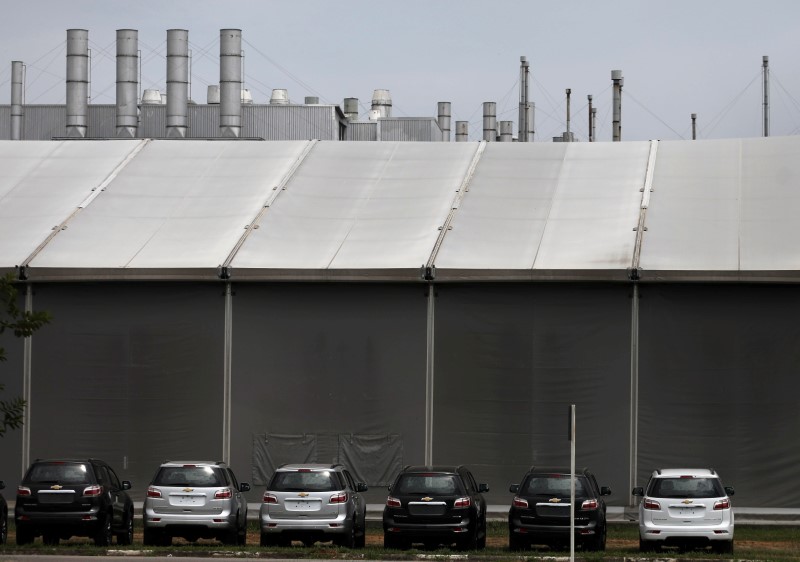 &copy; Reuters. Cars are pictured at the General Motors Co plant, that will give time off to its employees during the coronavirus disease (COVID-19) outbreak, in Sao Jose dos Campos
