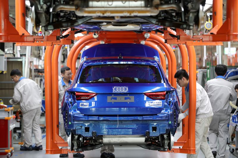 &copy; Reuters. Workers work on an assembly line manufacturing Audi Q3 cars at the FAW-Volkswagen Tianjin plant in Tianjin