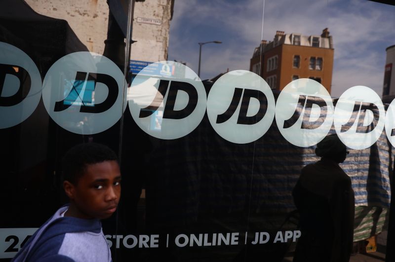 &copy; Reuters. People pass a JD Sports store in London