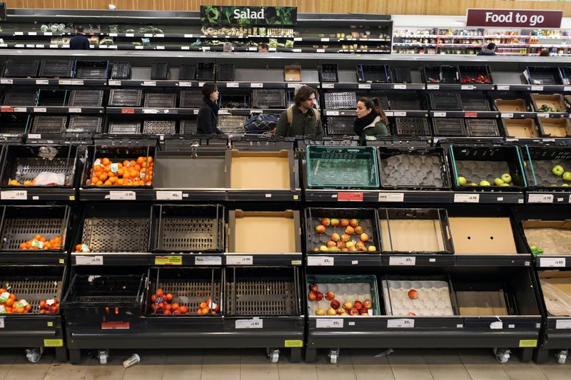 &copy; Reuters. People are seen at the fruit and vegetable aisle in Sainsbury&apos;s supermarket
